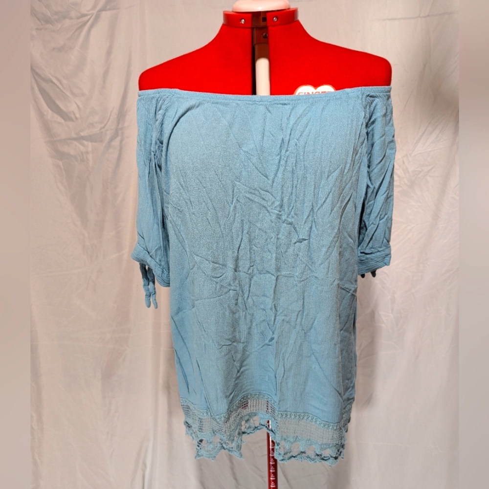 Light blue off shoulder lace hem top